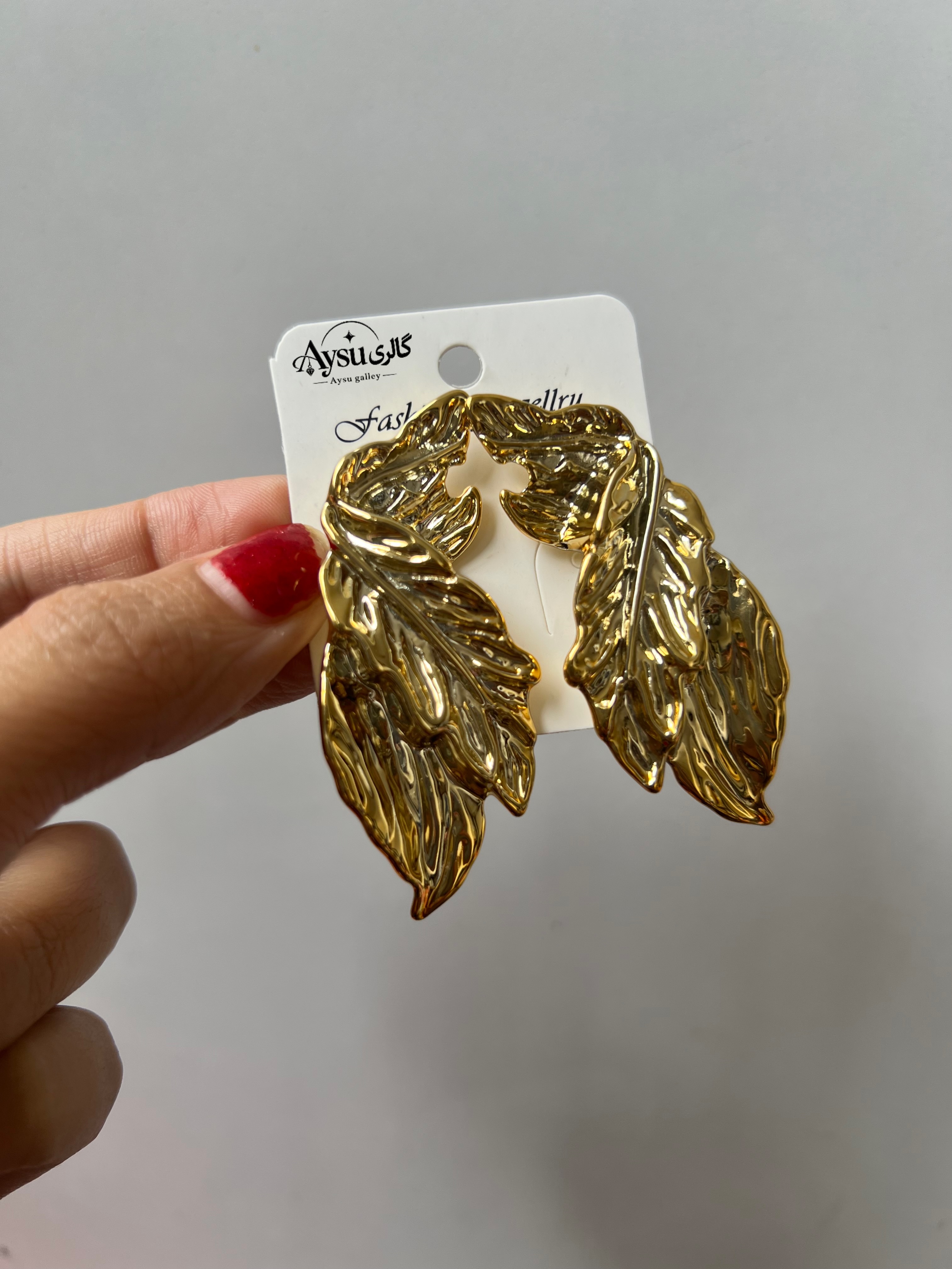 گوشواره طلایی برگ دفرمه شیک